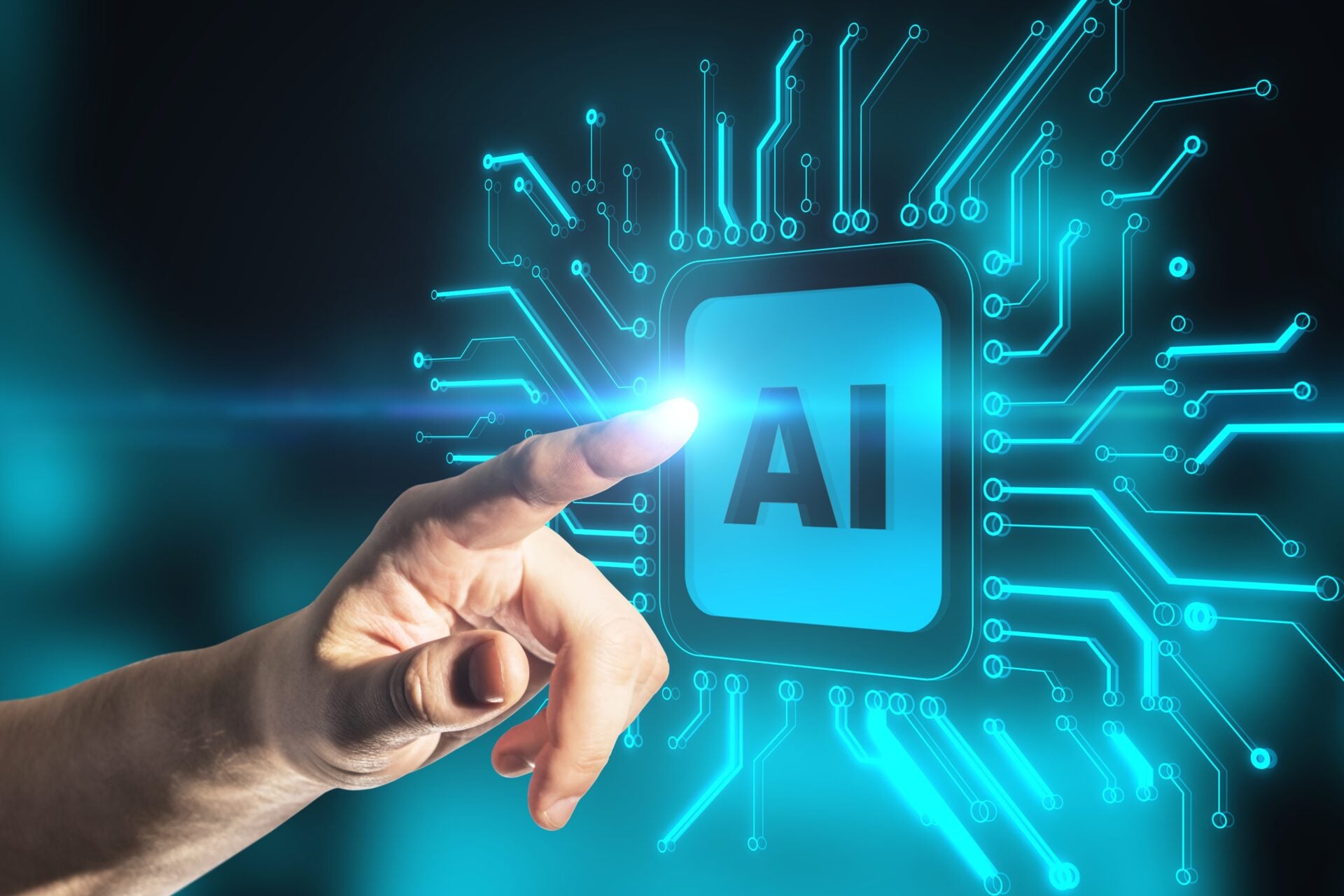 Hand touching AI emblem on a digital screen