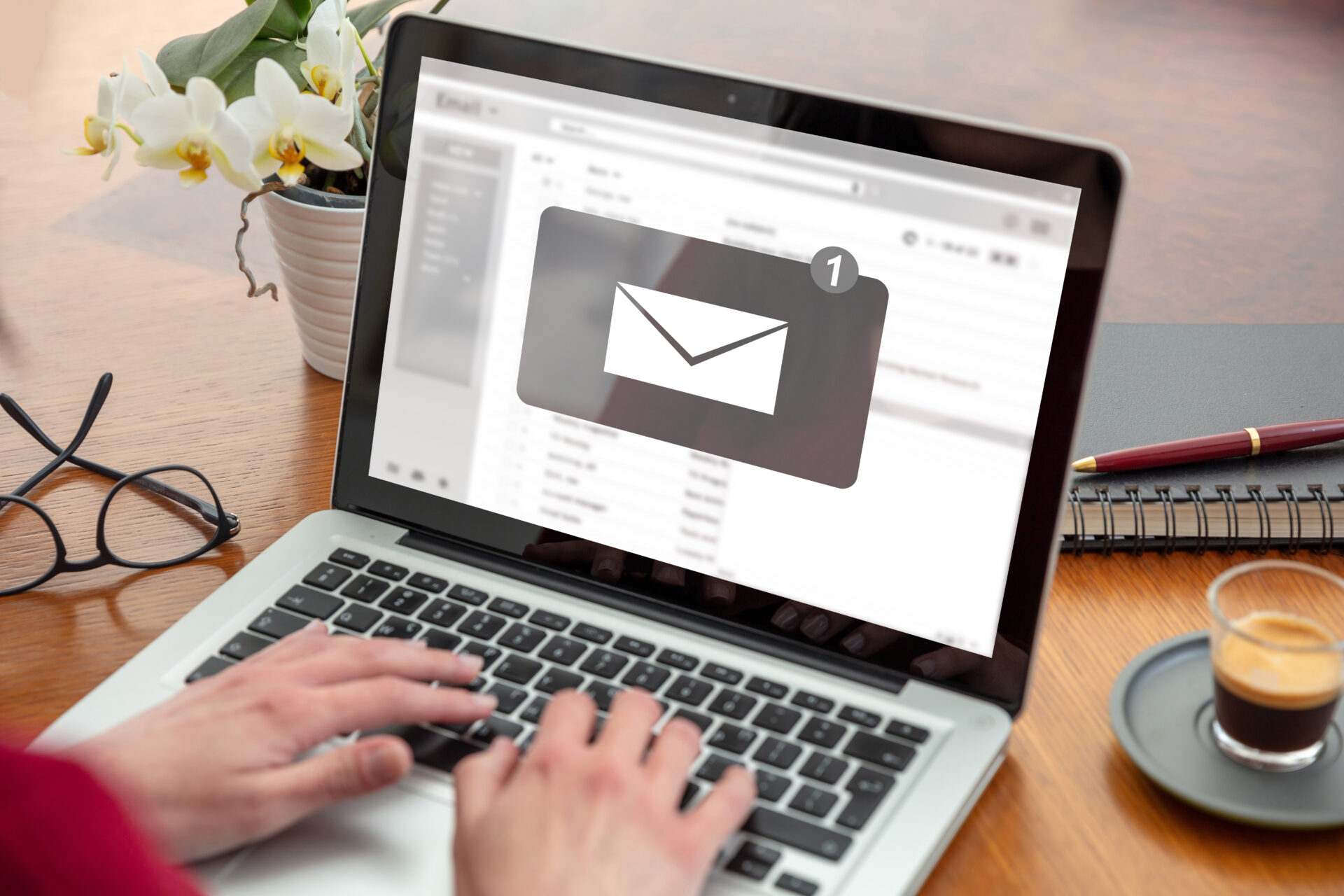 A person checking their email on a laptop