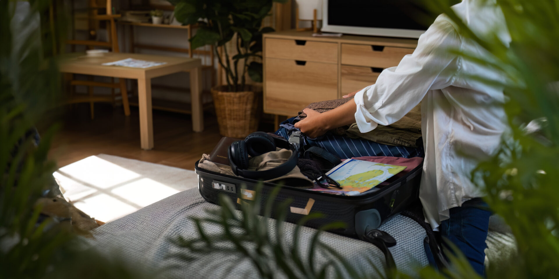 Close up young asian woman traveler pack bags prepare for the travel season vacation, concept travel lifestyle active journey and trip travel, passport.