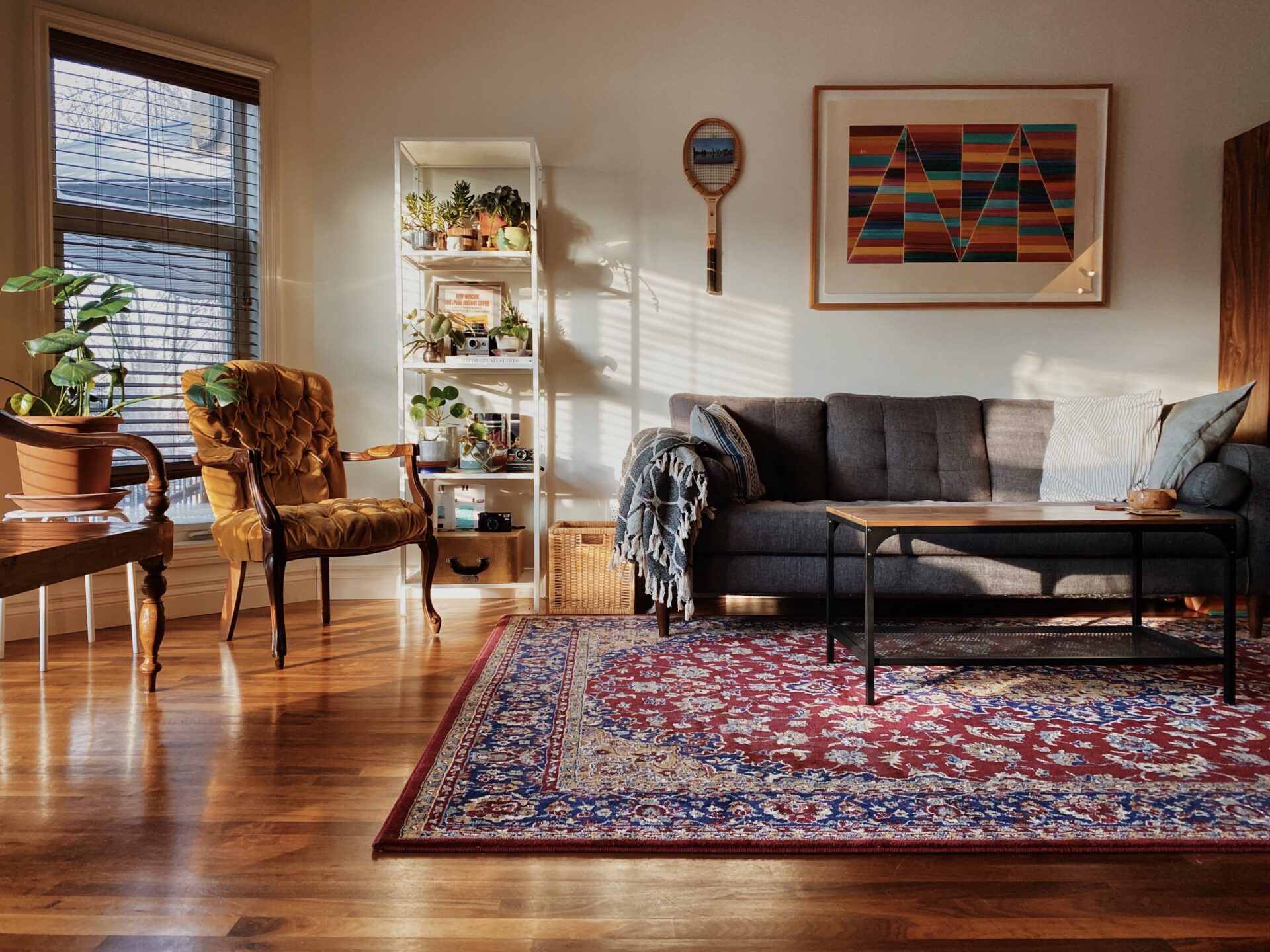 A living room with a colorful rug