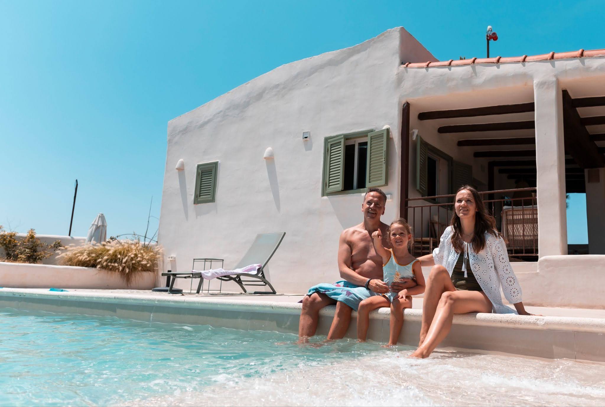 A family hanging out at a pool