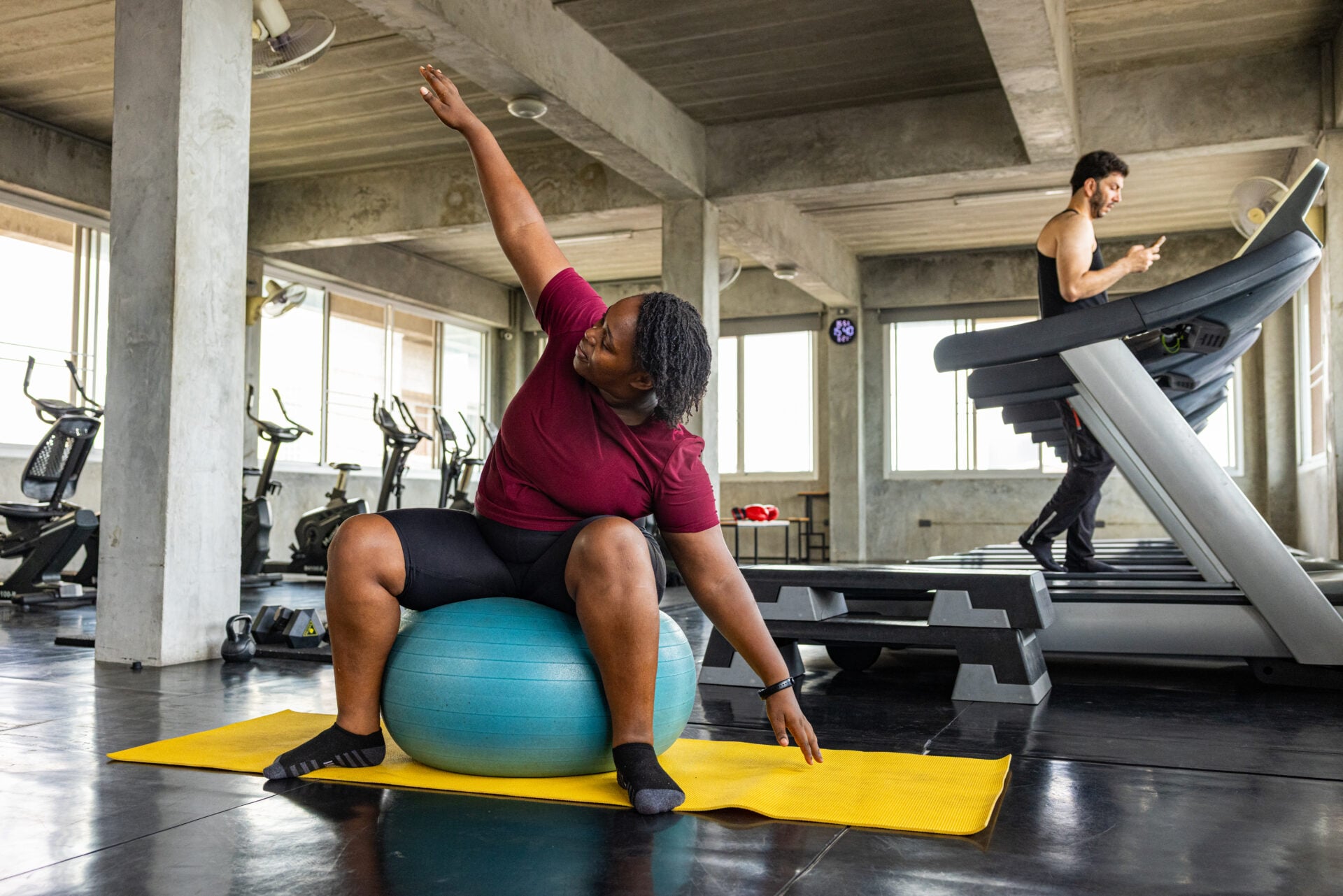 Athlete Performing Stability Ball Stretch in Gym