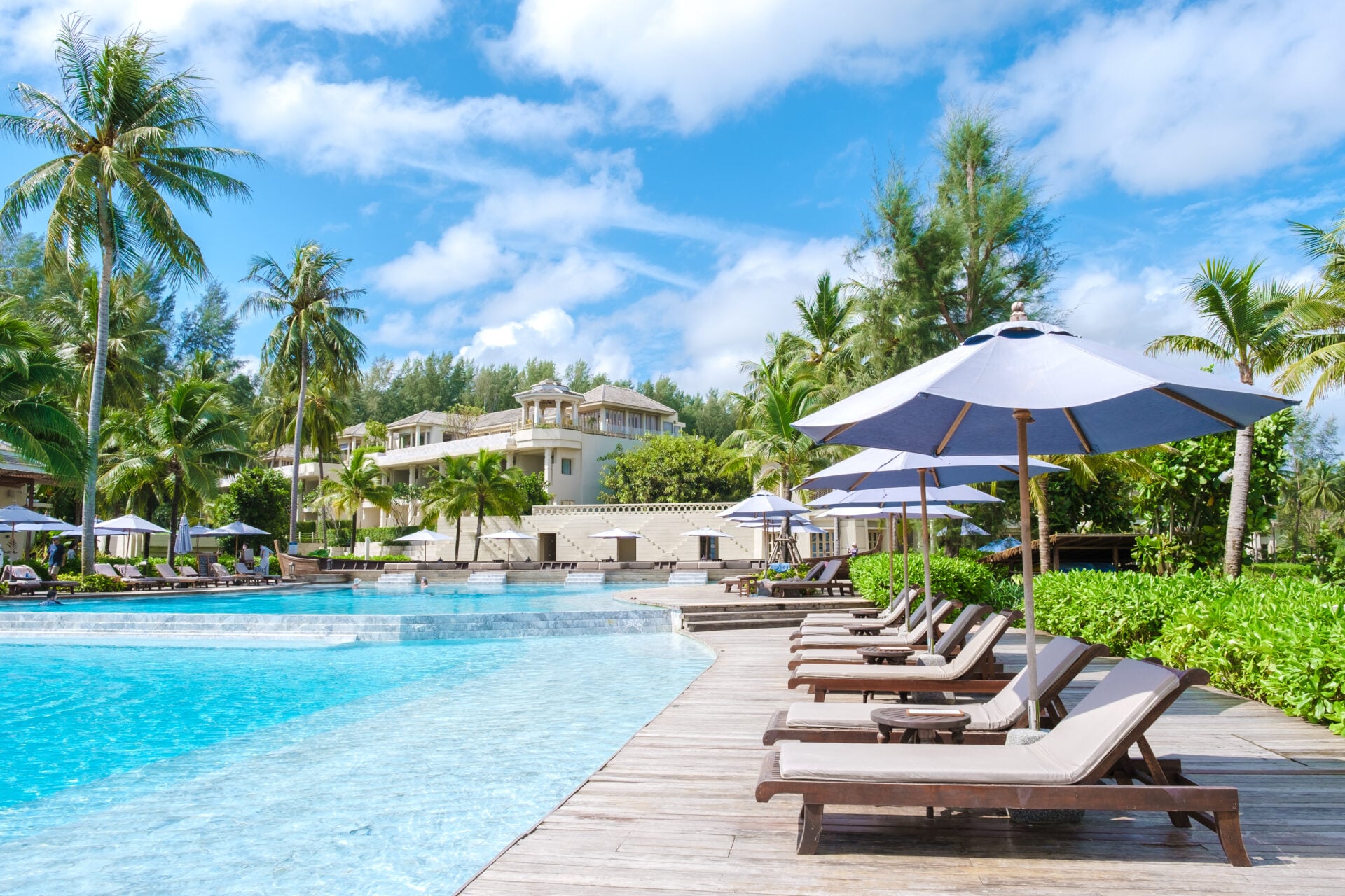 Khao Lak Thailand June 2022, Devasom a luxury hotel at the beach of Khao Lak in Arabic style, a modern hotel, with a beautiful swimming pool with bed chairs and sun loungers in Thailand