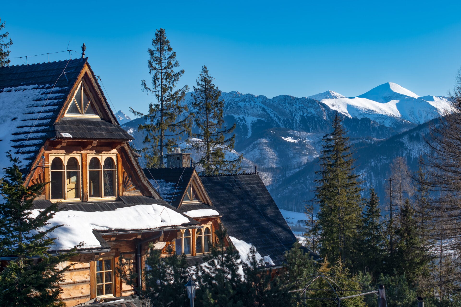 Traditional mountain houses in Zakopane in winter landscape, High Tatra Mountains, Poland