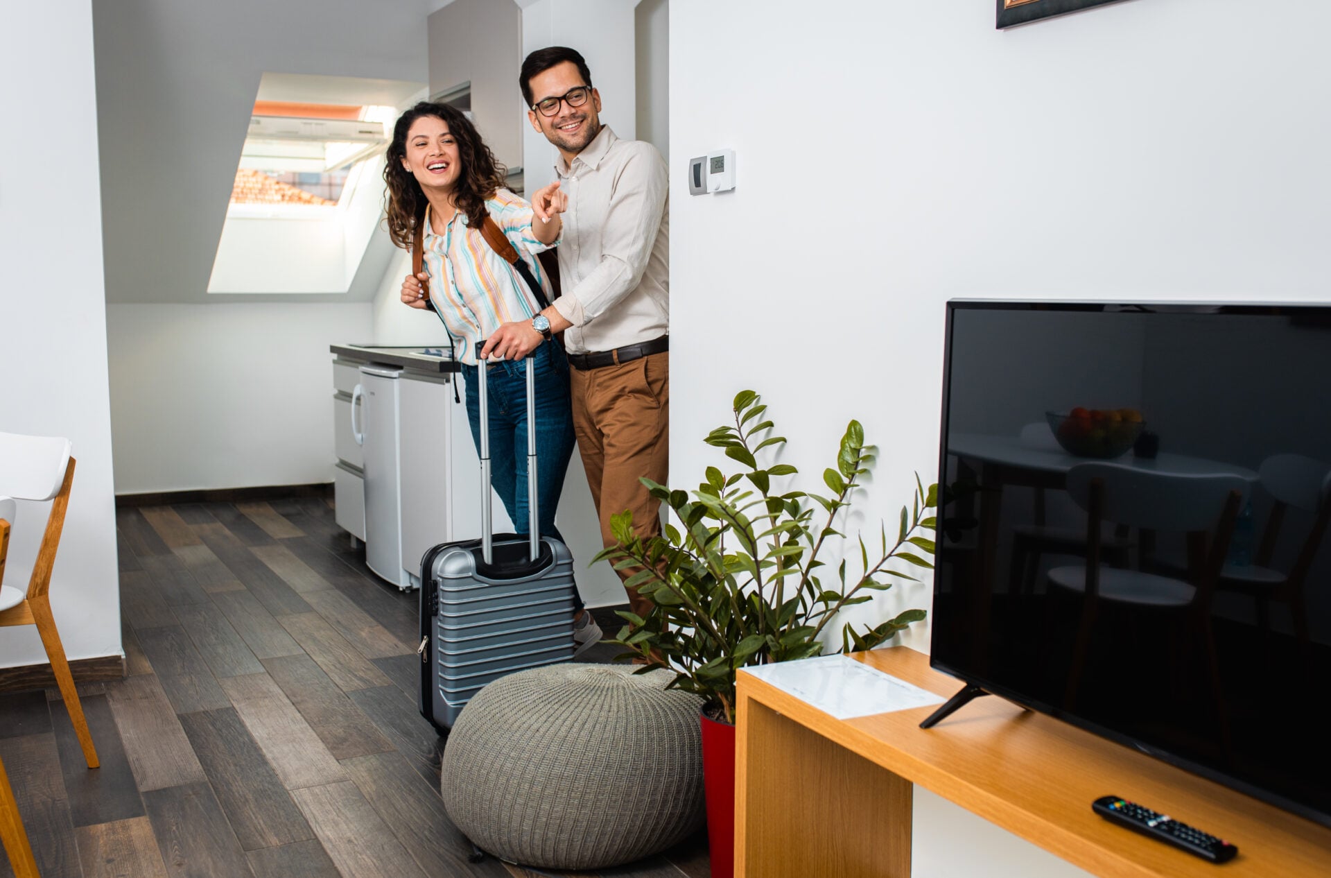 A couple walking into an Airbnb room