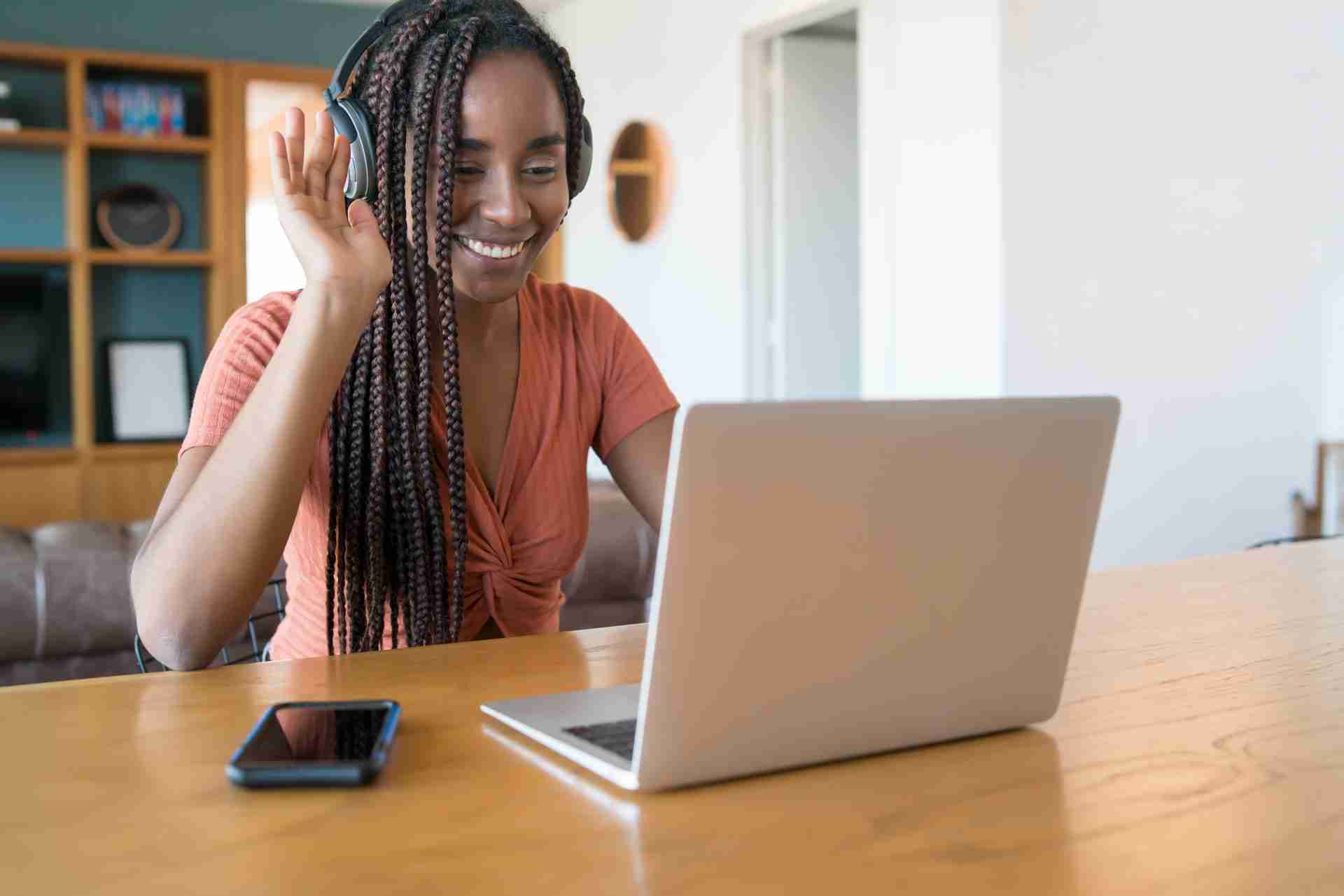 woman-working-from-home-M6J53RC Alt-text: Woman receiving customer support from Host Tools