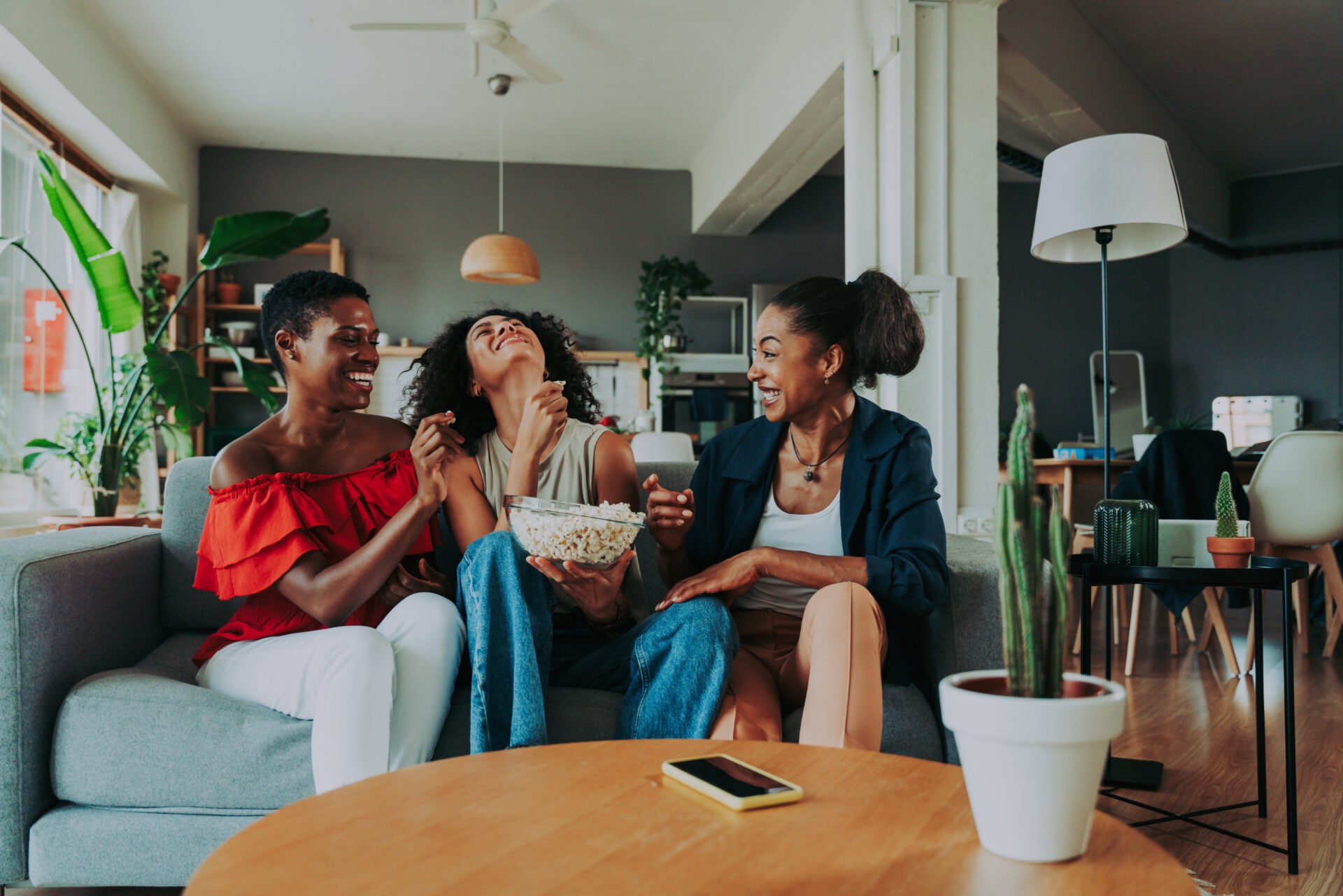 Women in living room laughing